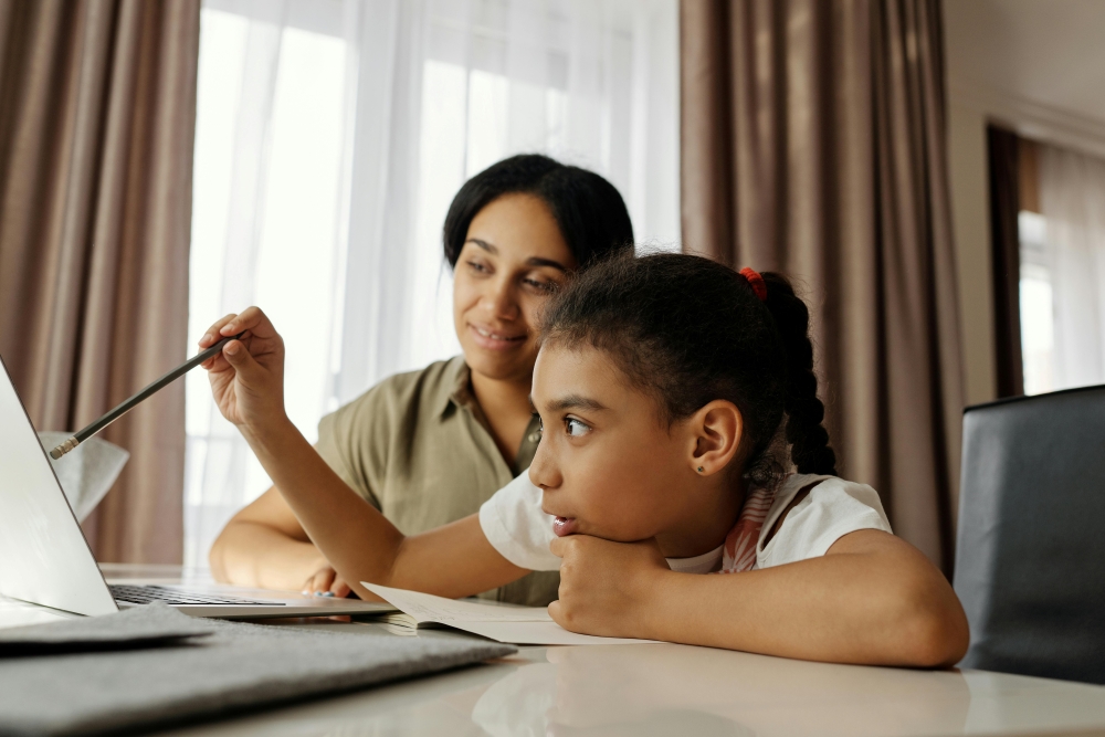 child learning from a laptop